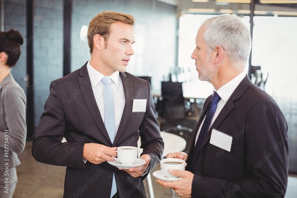 Businesspeople having a discussion during break time