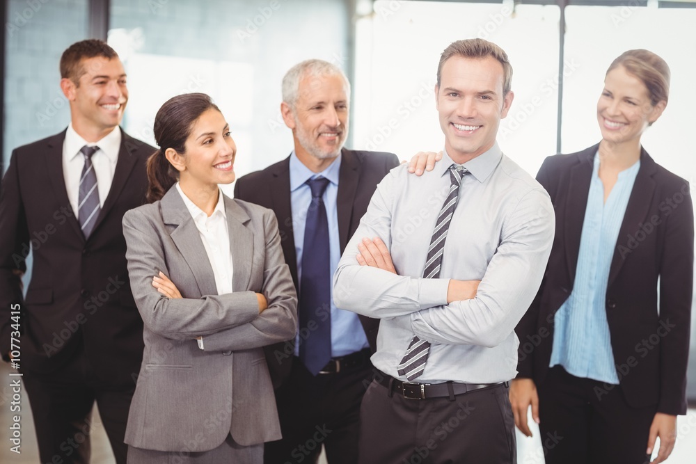 Businesspeople standing with arms crossed Businesspeople standing with arms crossed