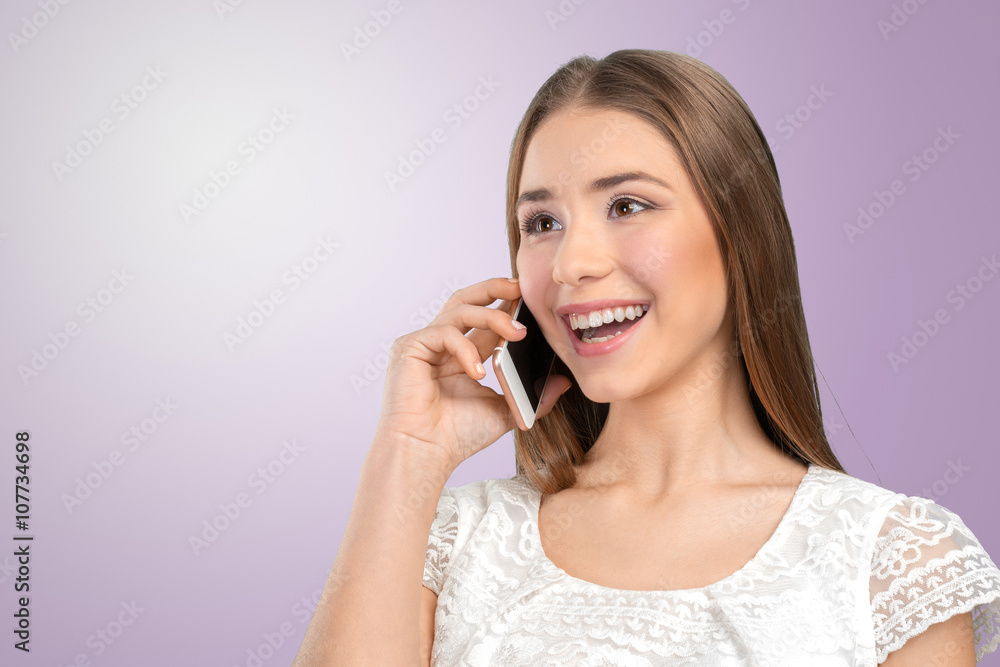 Young elegant woman talking on mobile phone Young elegant woman talking on mobile phone
