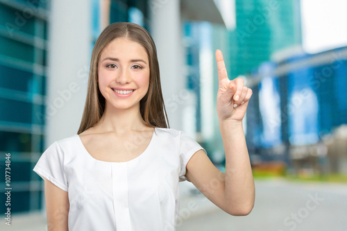 Beautiful happy smiling woman showing copy space