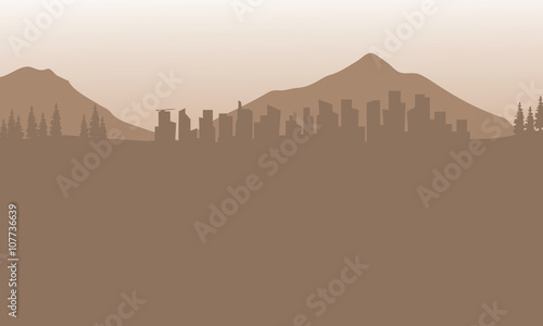 Silhouette of city and mountain with brown background