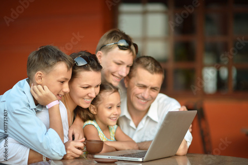 happy family with laptop