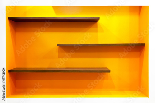 Orange empty modern design shelves on wall
