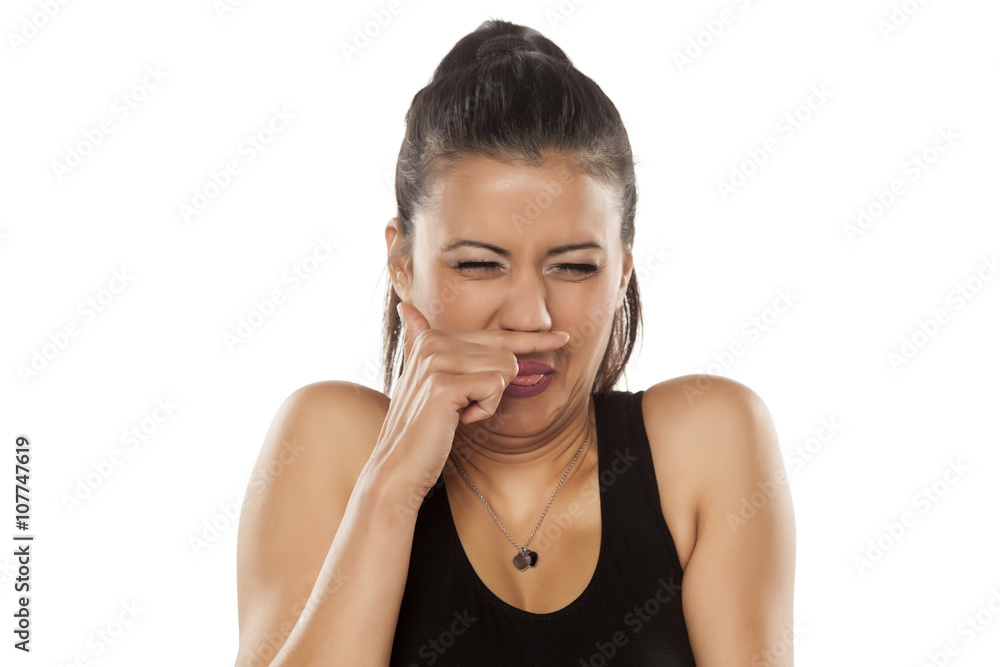 beautiful young woman is disgusted by the smell beautiful young woman is disgusted by the smell