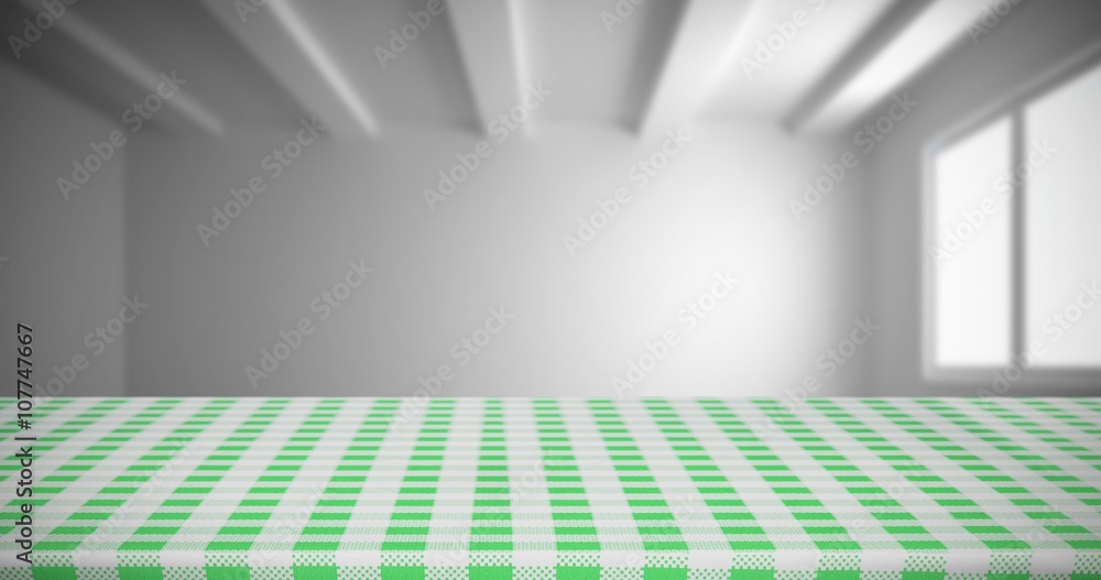 Composite image of white and green tablecloth
