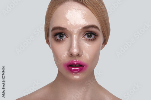Surprised Woman with wet Skin and pink Lips