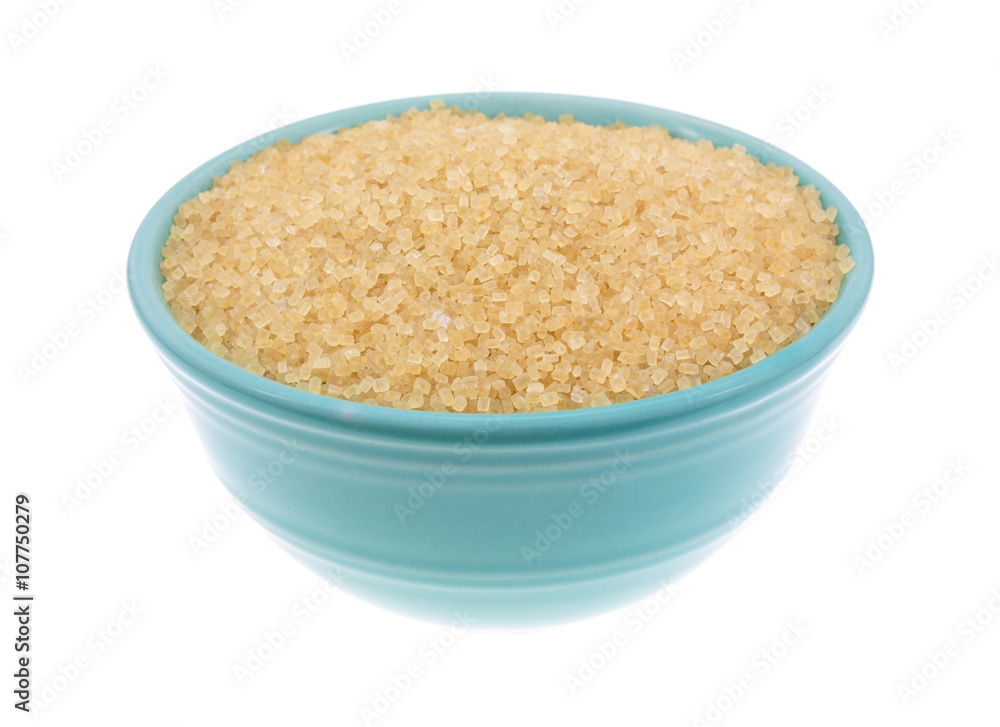 Bowl filled with turbinado sugar on a white background Bowl filled with turbinado sugar on a white background
