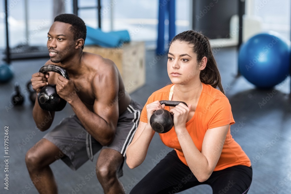 Athletic man and woman working out Athletic man and woman working out