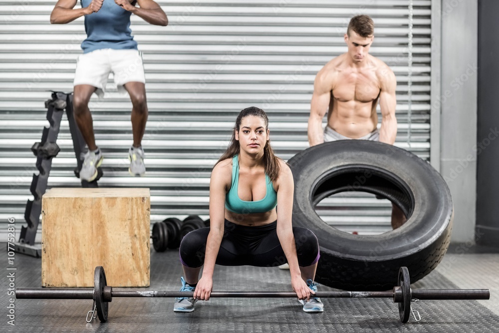 Fototapeta premium Fit people exercising together
