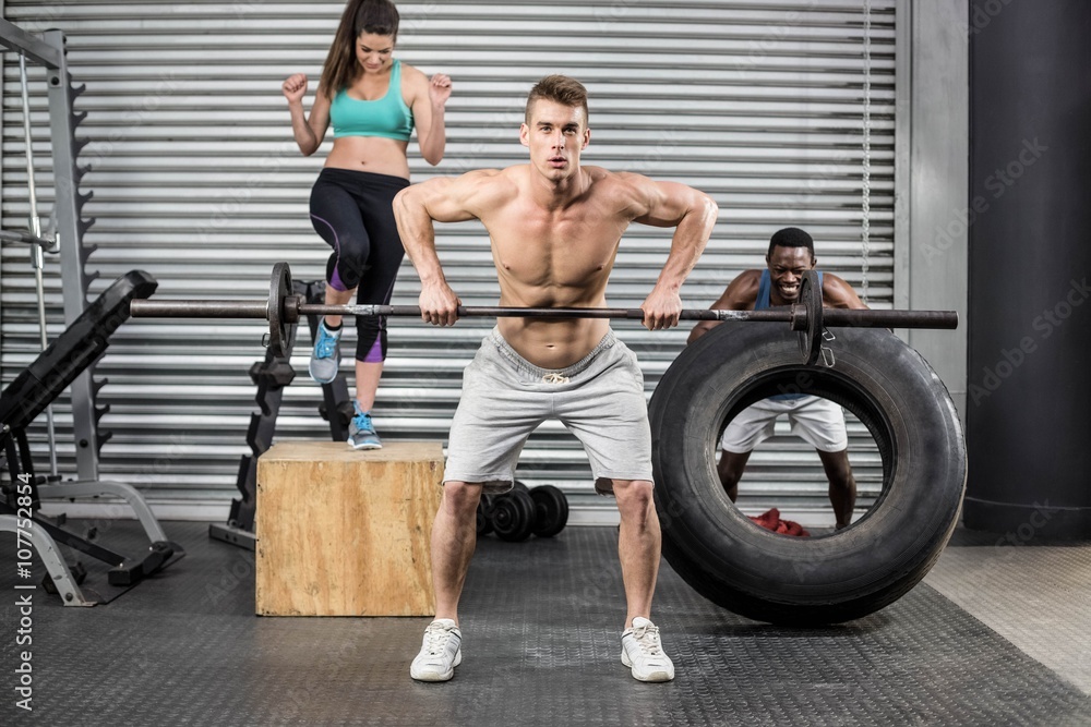 Fototapeta premium Fit people exercising together