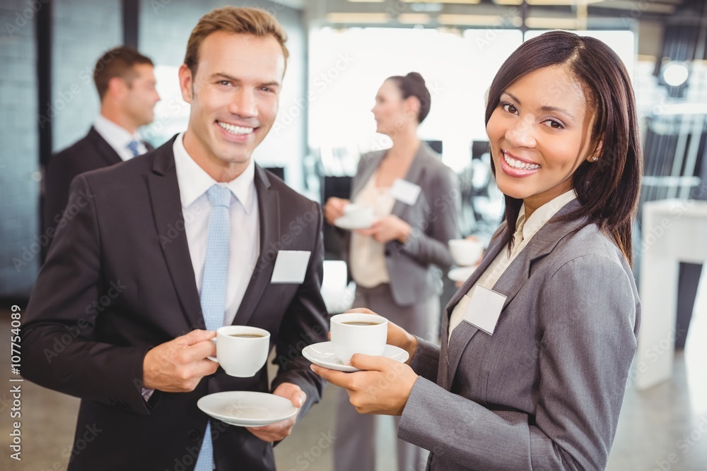 Businesspeople having a discussion during break time Businesspeople having a discussion during break time