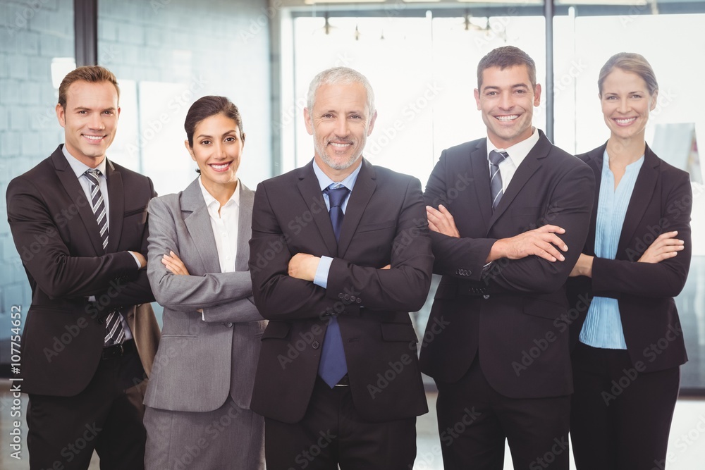 Businesspeople standing with arms crossed Businesspeople standing with arms crossed