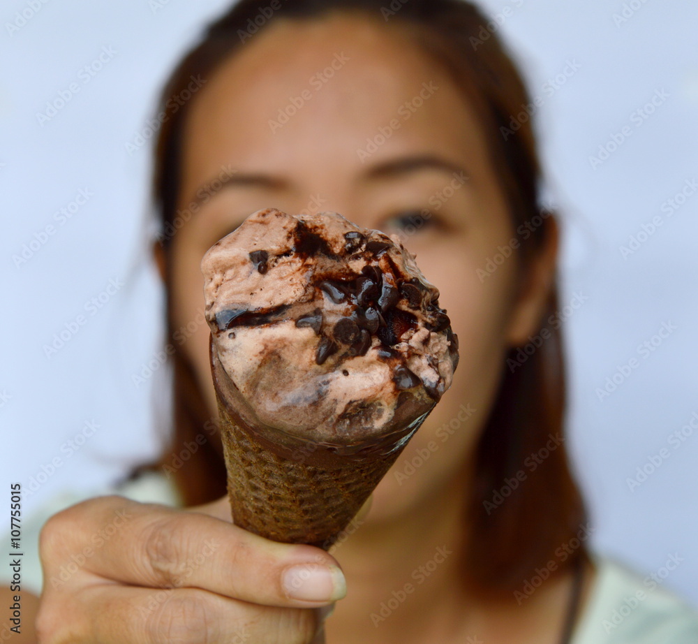 chocolate ice cream in front of woman