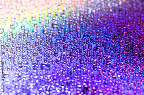 water drip on Purple Compact disc macro shot