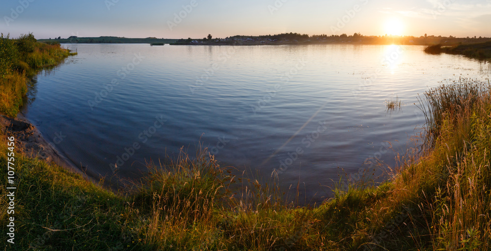 Sunset lake summer panorama.