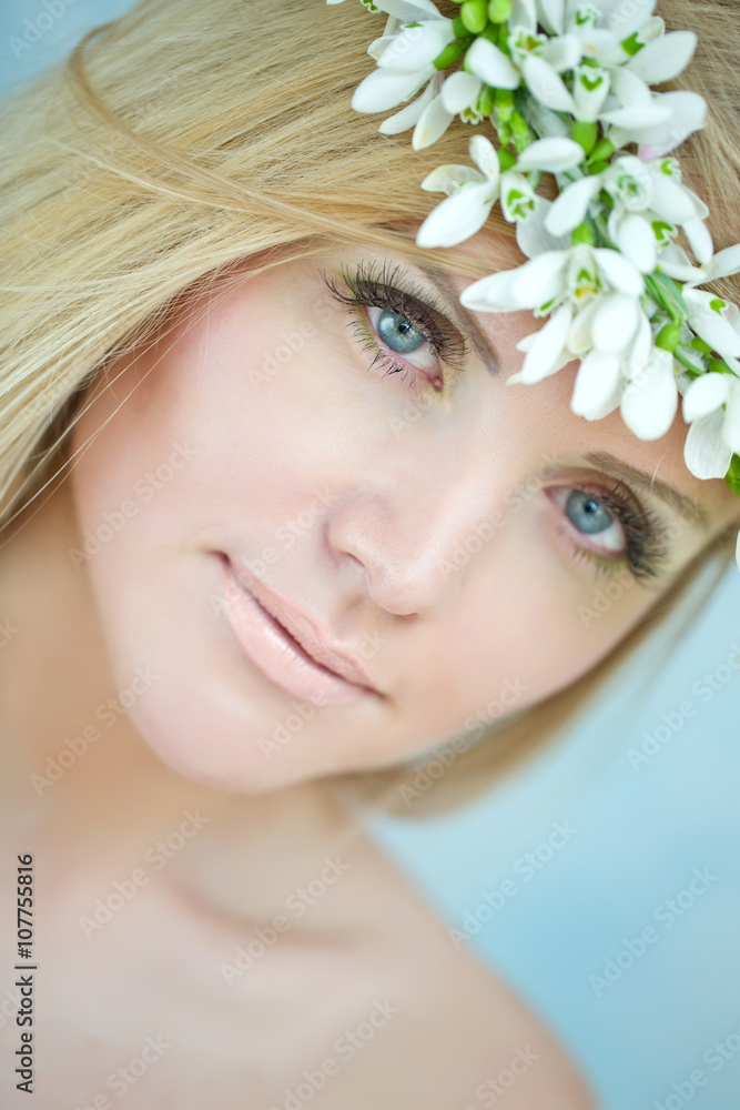 woman with snowdrops bunch 