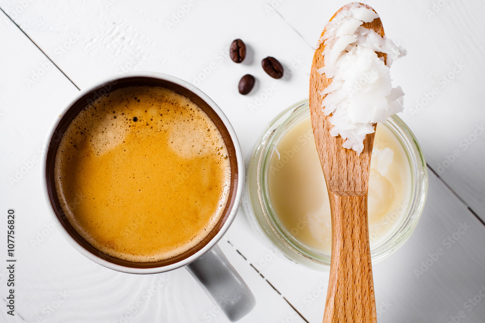Bulletproof coffee, it's a coffee blended with butter or coconut oil. Wiev from above on coffee and coconut. Part of ketogenic diet, better choice before trainning.