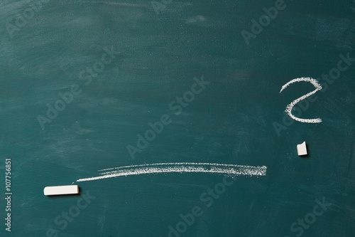 Empty green chalkboard with line and question mark