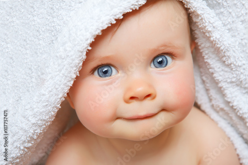 baby under a towel photo