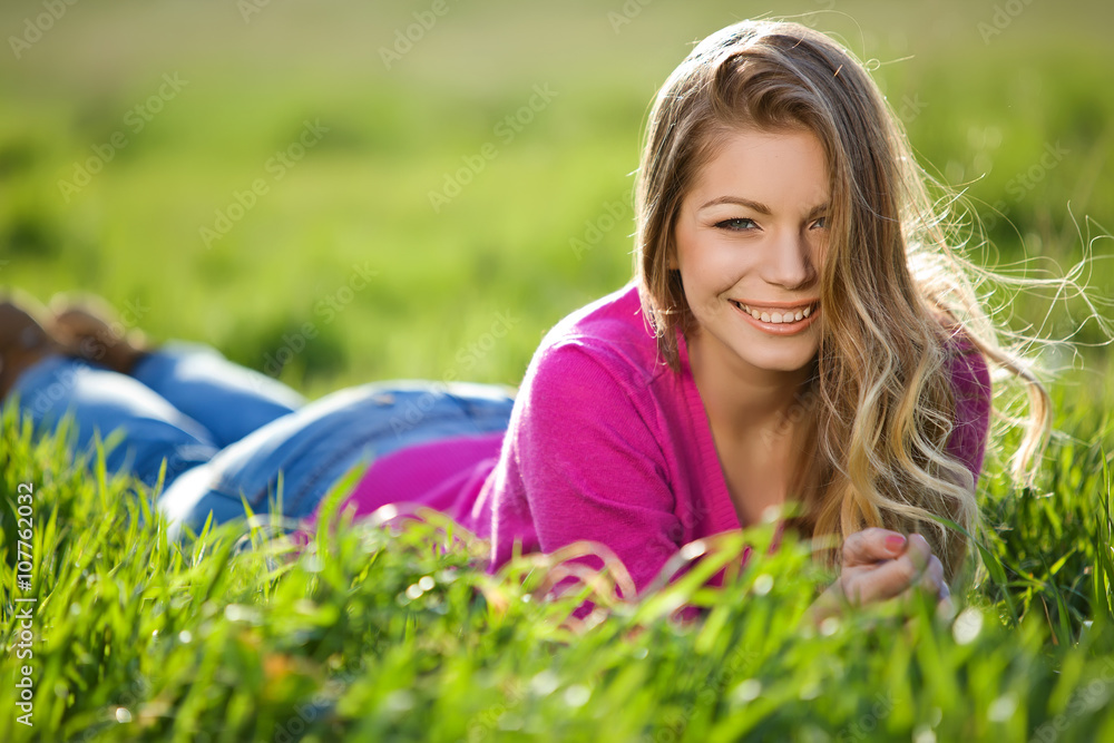 woman are relaxing on the green field woman are relaxing on the green field