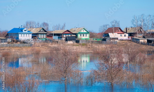 Spring flood of the river and the village on the shore