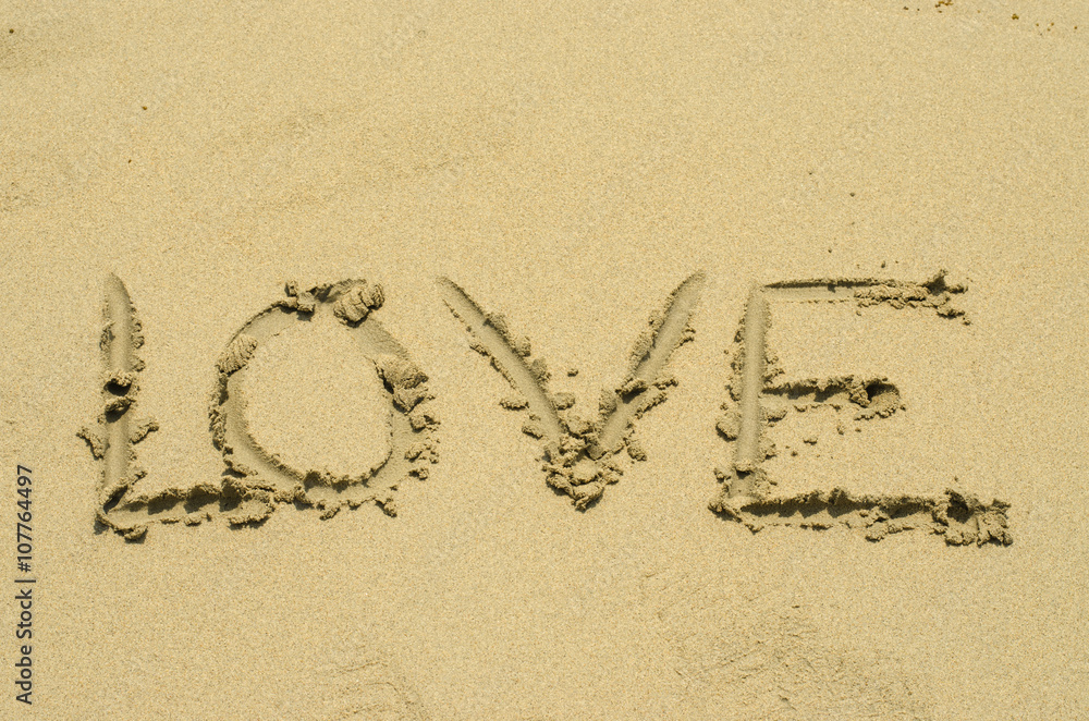 the word love on beach