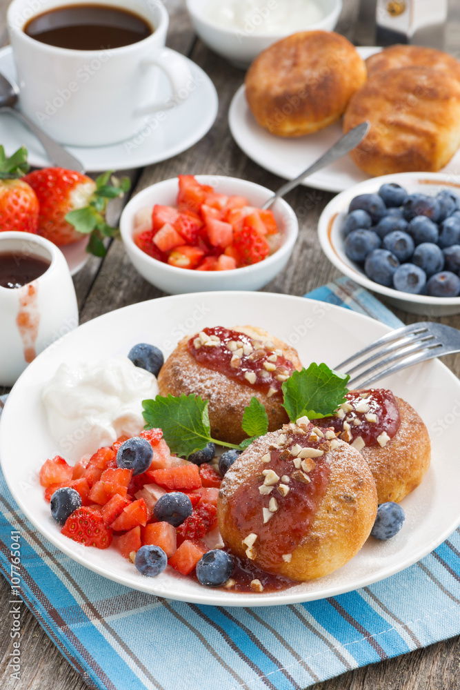 sweet cheese pancakes with berries and cream, vertical, top view sweet cheese pancakes with berries and cream, vertical, top view