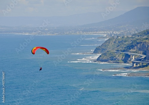 Paragliding at Stanwell Park, Sea Cliff bridge in the background, New South Wales, Australia