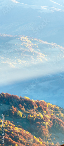 Sunbeam and autumn misty mountain.