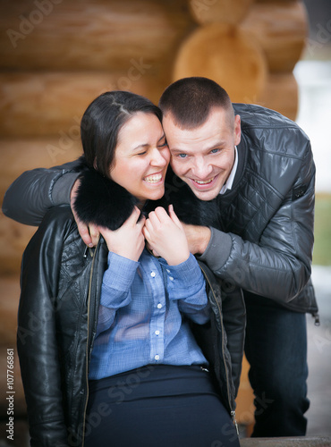 Young cheerful couple in a cabin in romantic scape in winter © Andriy Petrenko
