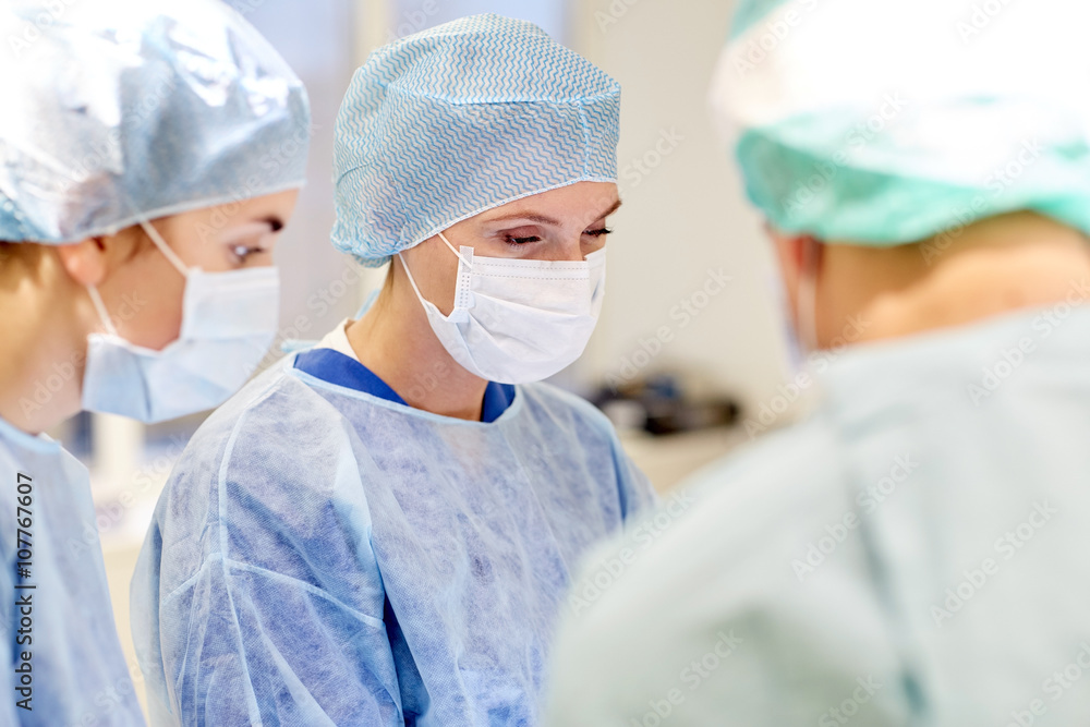 group of surgeons in operating room at hospital group of surgeons in operating room at hospital
