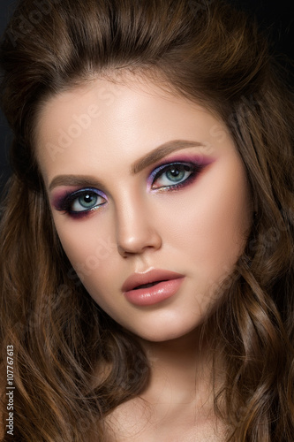 Fototapeta Naklejka Na Ścianę i Meble -  Close up portrait of young beautiful woman with fashion makeup