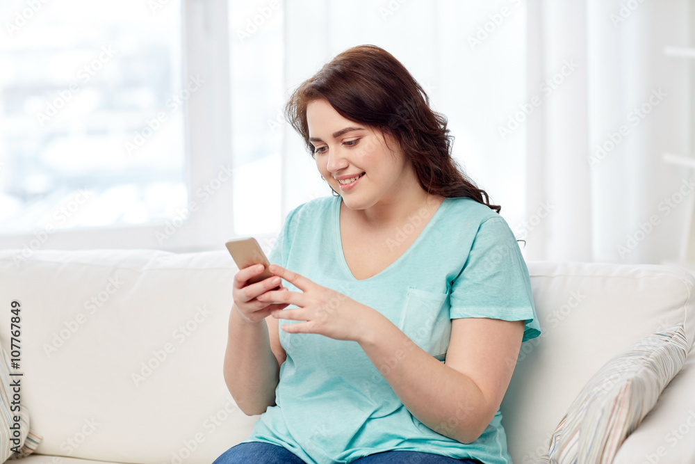 happy plus size woman with smartphone at home happy plus size woman with smartphone at home