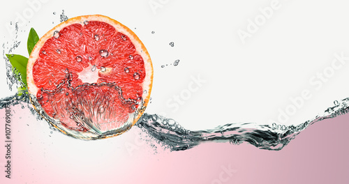 Grapefruit on a background of splashing water.
