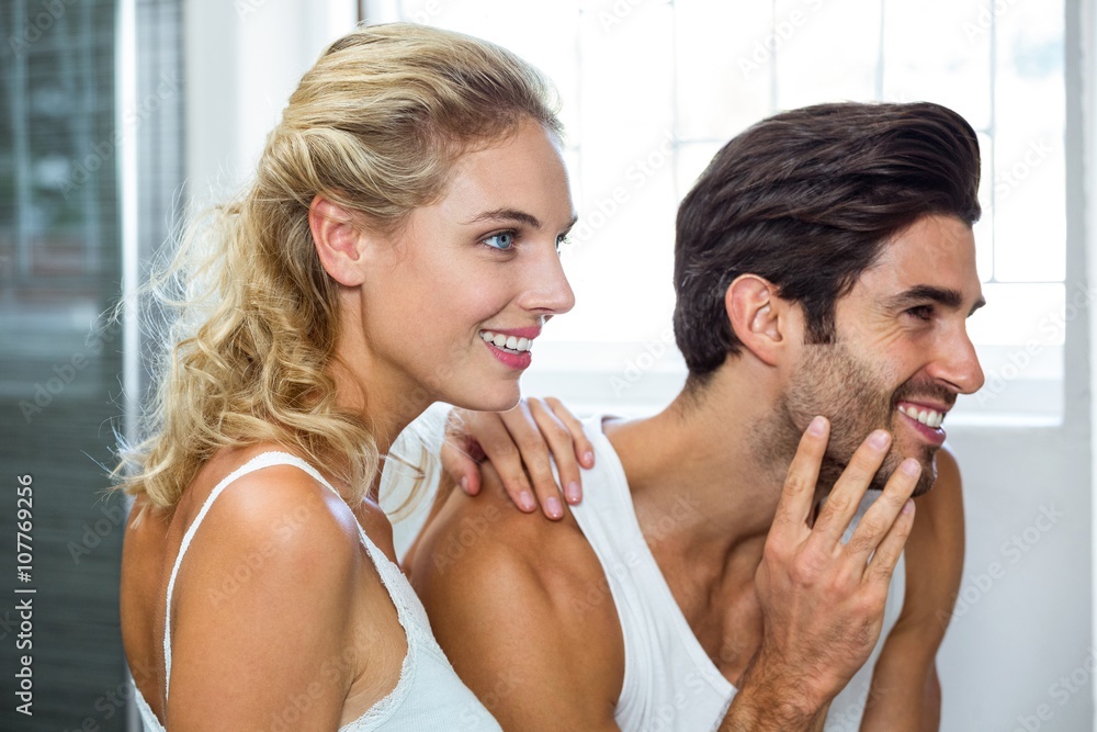 Man checking his stubble in bathroom Man checking his stubble in bathroom