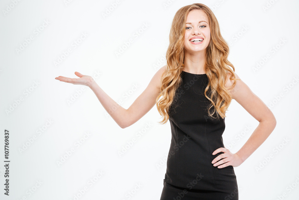 Cheerful woman holding copyspace on the palm Cheerful woman holding copyspace on the palm
