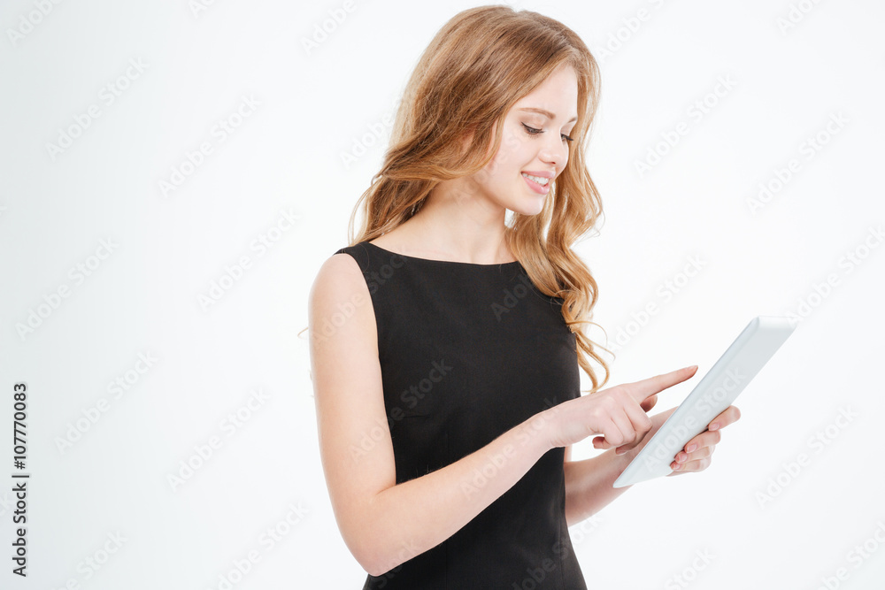 Happy attractive young businesswoman using tablet Happy attractive young businesswoman using tablet