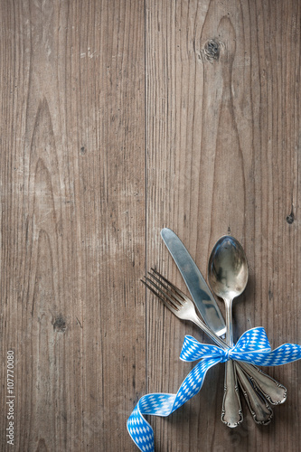 Bavarian cutlery on wooden table with copy space