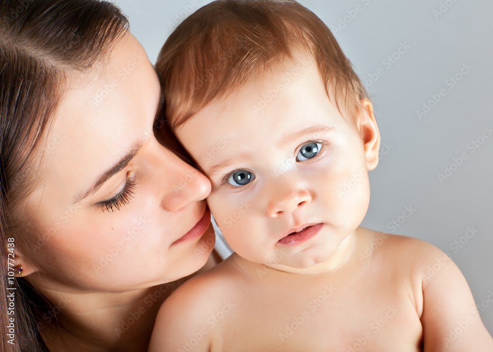 A mother with a baby in her arms A mother with a baby in her arms