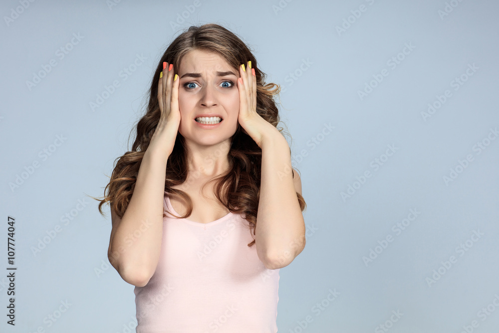 Portrait of young woman with shocked facial expression Portrait of young woman with shocked facial expression