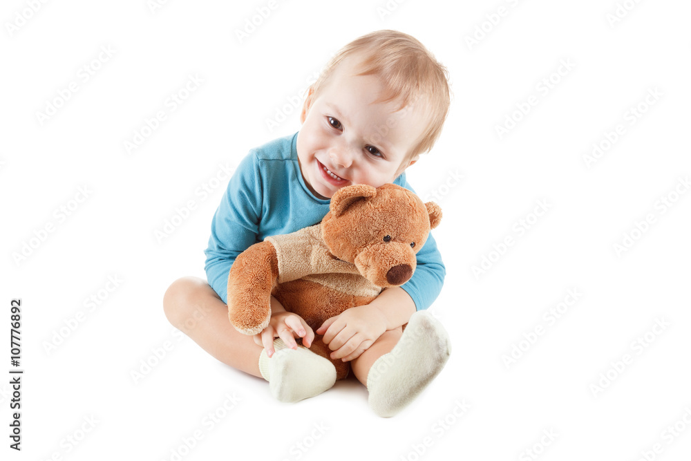 Little boy hugging a teddy bear on white background Stock Photo | Adobe ...