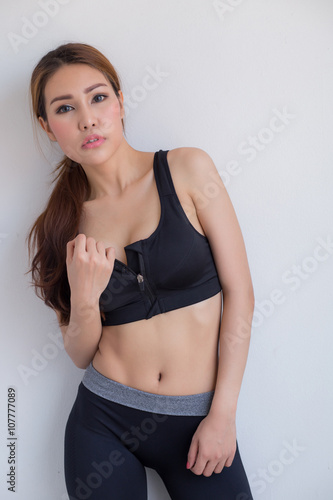 Beautiful shapely woman wearing workout emotion. © chaiviewfinder