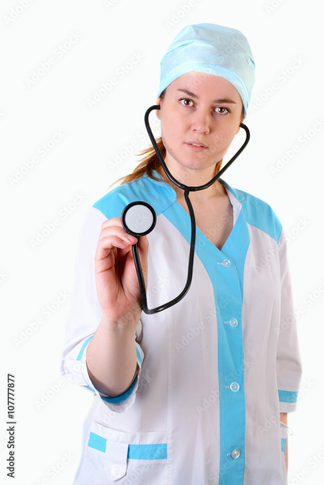 Female doctor holding a stethoscope, focus on stethoscope, isolated over a white background Female doctor holding a stethoscope, focus on stethoscope, isolated over a white background