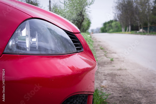 Headlight of red car  © kemilii