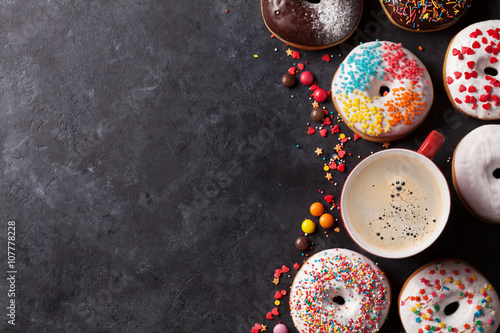 Colorful donuts and coffee cup