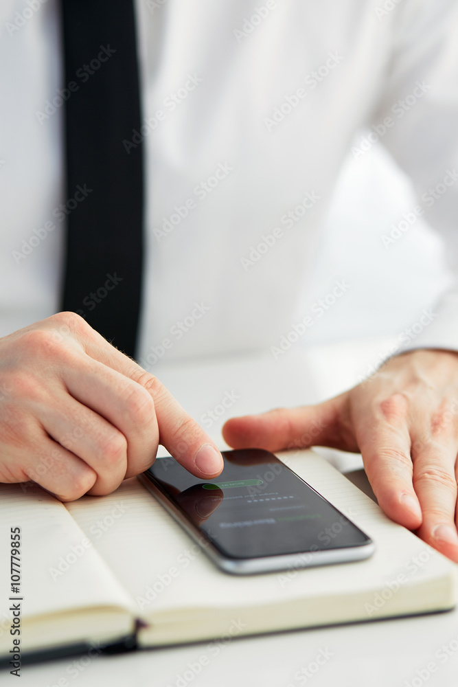 Man trying to log in mobile banking Man trying to log in mobile banking