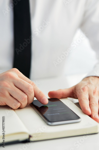 Man trying to log in mobile banking