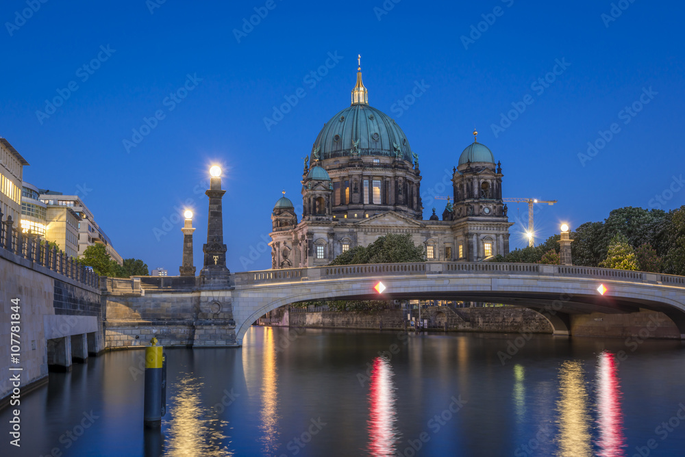 Berlin Cathedral (Berliner Dom) on Museum Island (Museumsinsel) and bridge (Friedrichsbruecke) over Spree River at evening, Berlin Mitte, Germany, Europe
