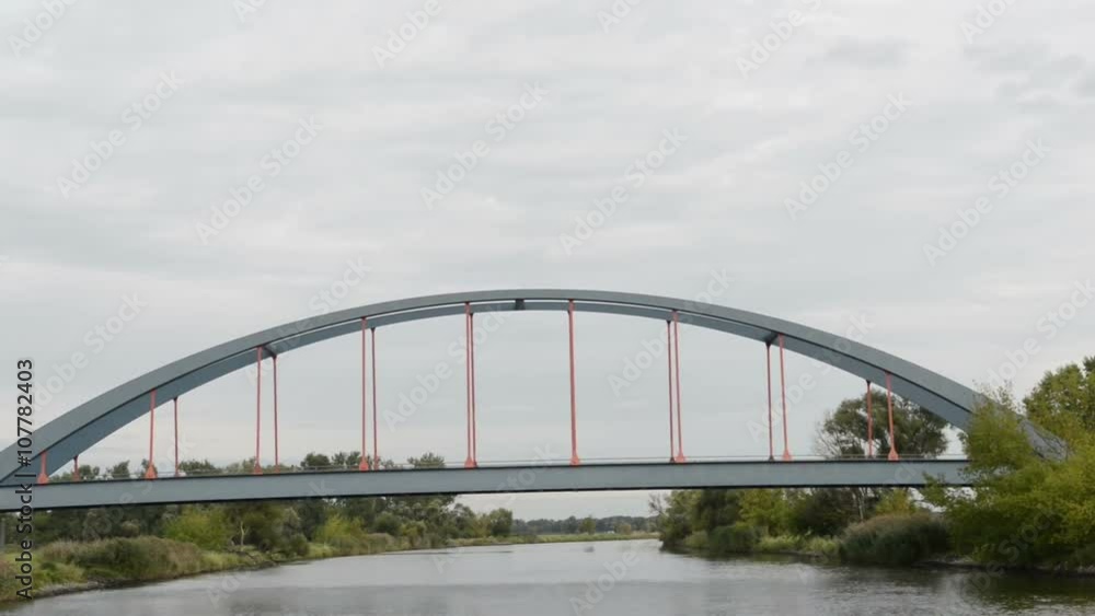 Bridge over the Havel river at village Strodehne. landscape with willow tree and meadows. Bridge over the Havel river at village Strodehne. landscape with willow tree and meadows.