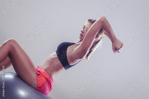woman doing fitness exercises with fit ball